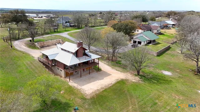 a view of a house with a big yard