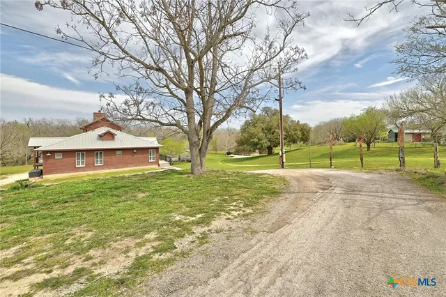 a view of a lake with a house in the background