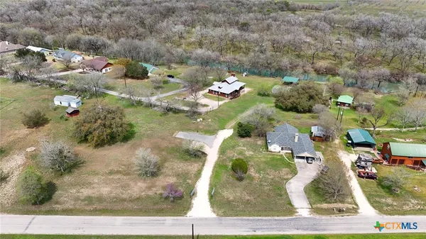 an aerial view of a residential houses with outdoor space
