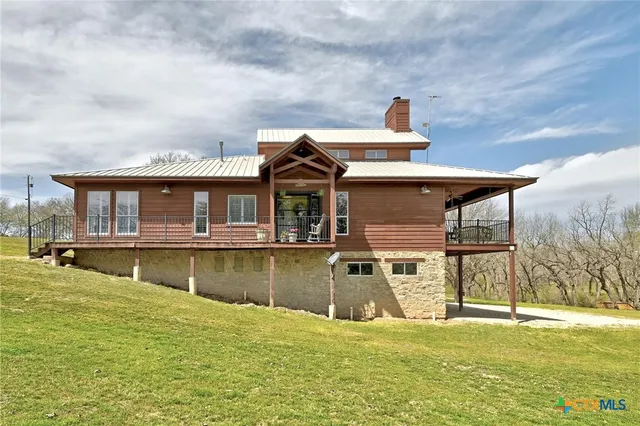 a view of balcony with wooden floor