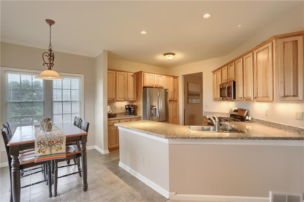 263 Randy Lane Coraopolis, PA 15108 - Photo 8 of 25 New lighting, open concept to living room, granite countertops
