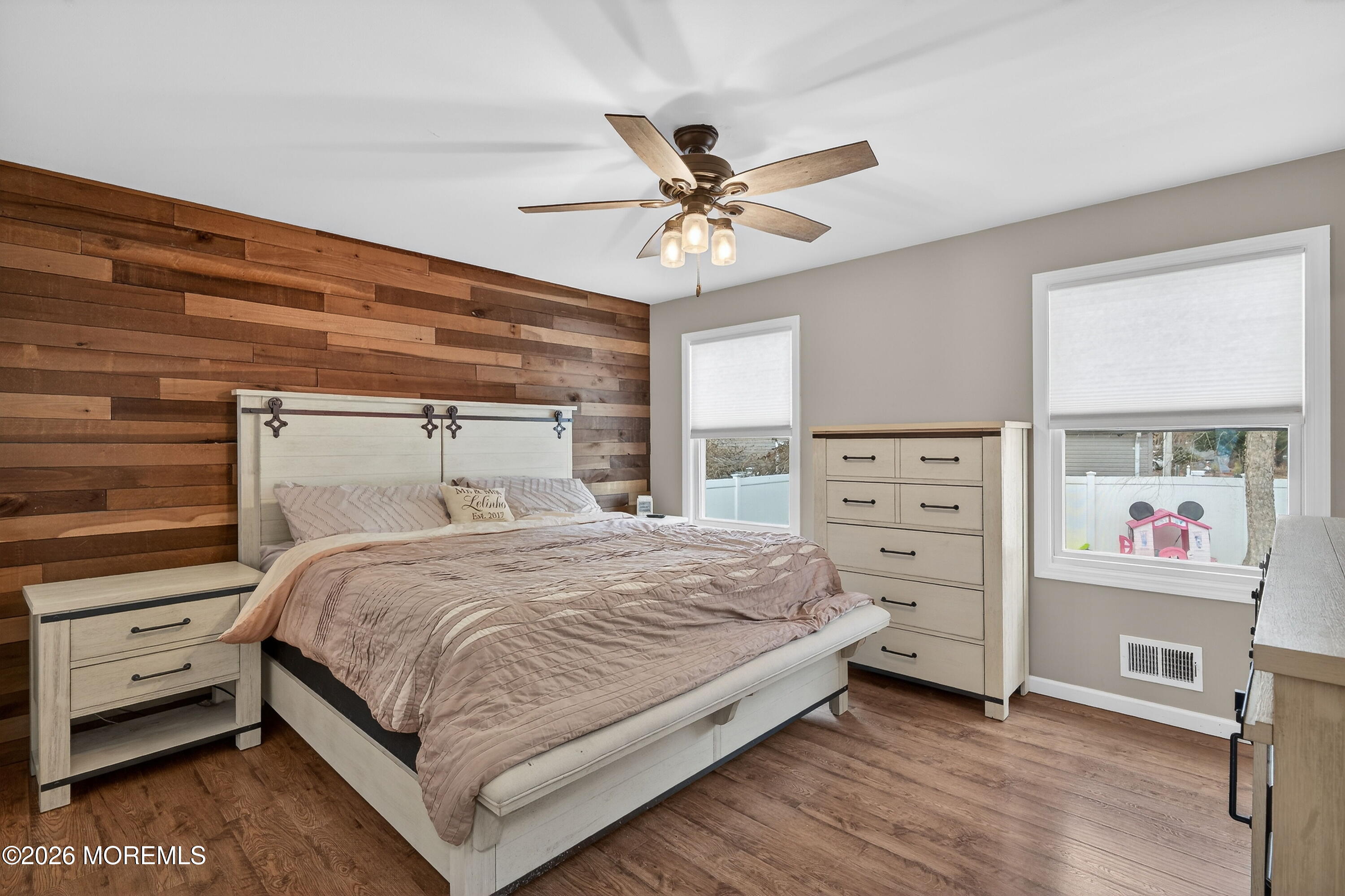 1660 Joffre Road Forked River, NJ 08731 - Photo 13 of 35 a bedroom with a bed and a chandelier