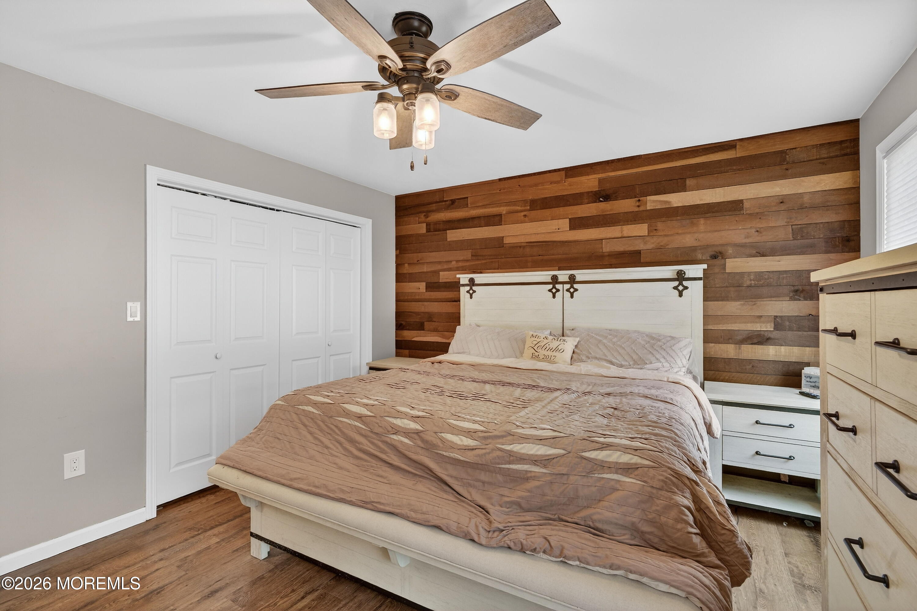 1660 Joffre Road Forked River, NJ 08731 - Photo 14 of 35 a bedroom with a bed and a chandelier