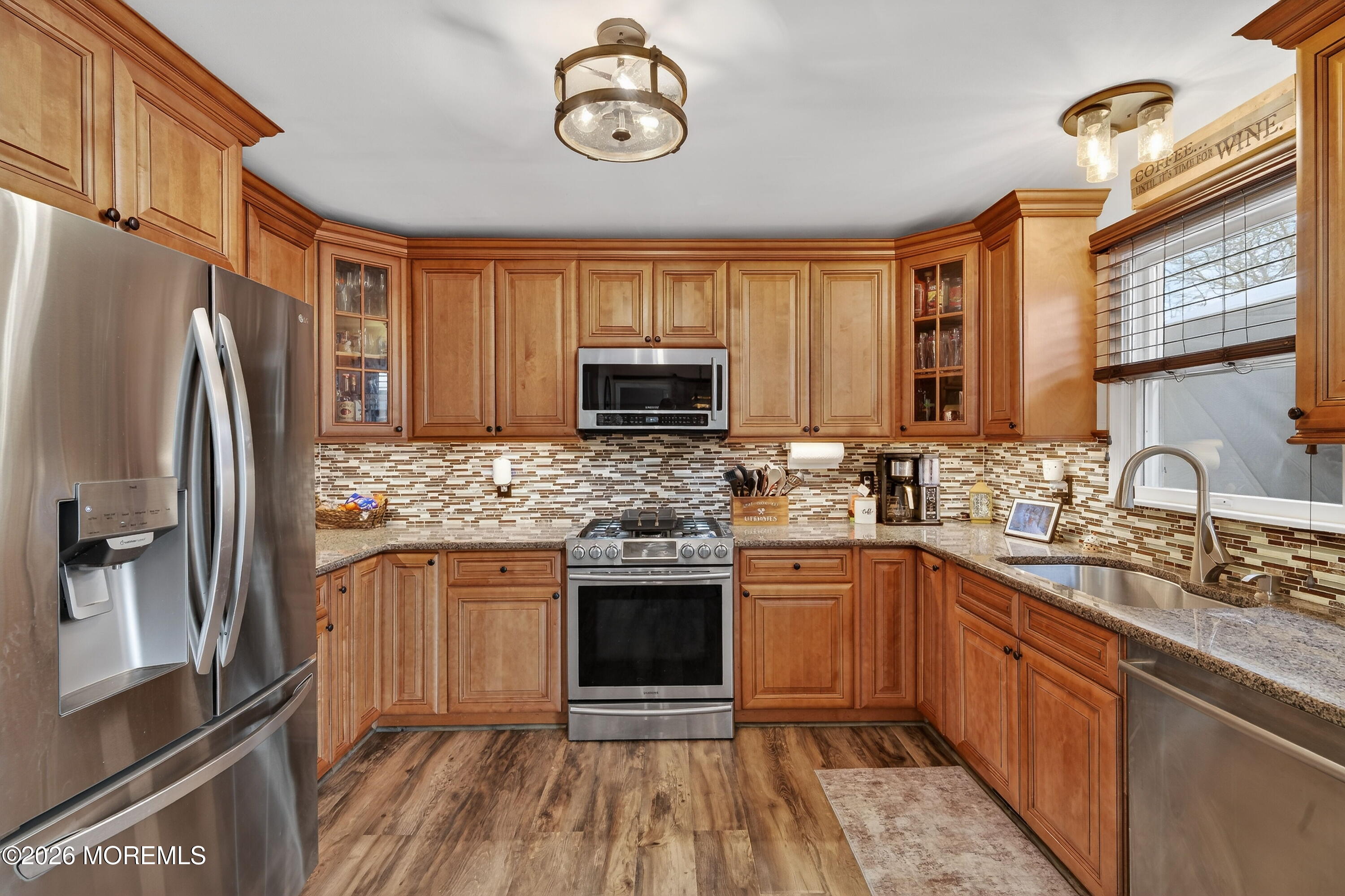 1660 Joffre Road Forked River, NJ 08731 - Photo 21 of 35 a kitchen with stainless steel appliances granite countertop a stove refrigerator sink and microwave