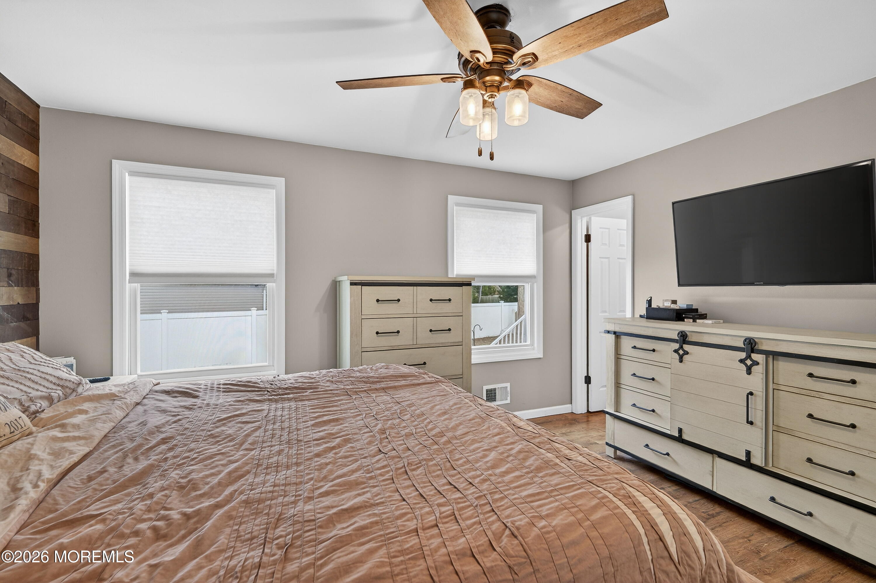 1660 Joffre Road Forked River, NJ 08731 - Photo 23 of 35 a bedroom with a bed and a flat screen tv