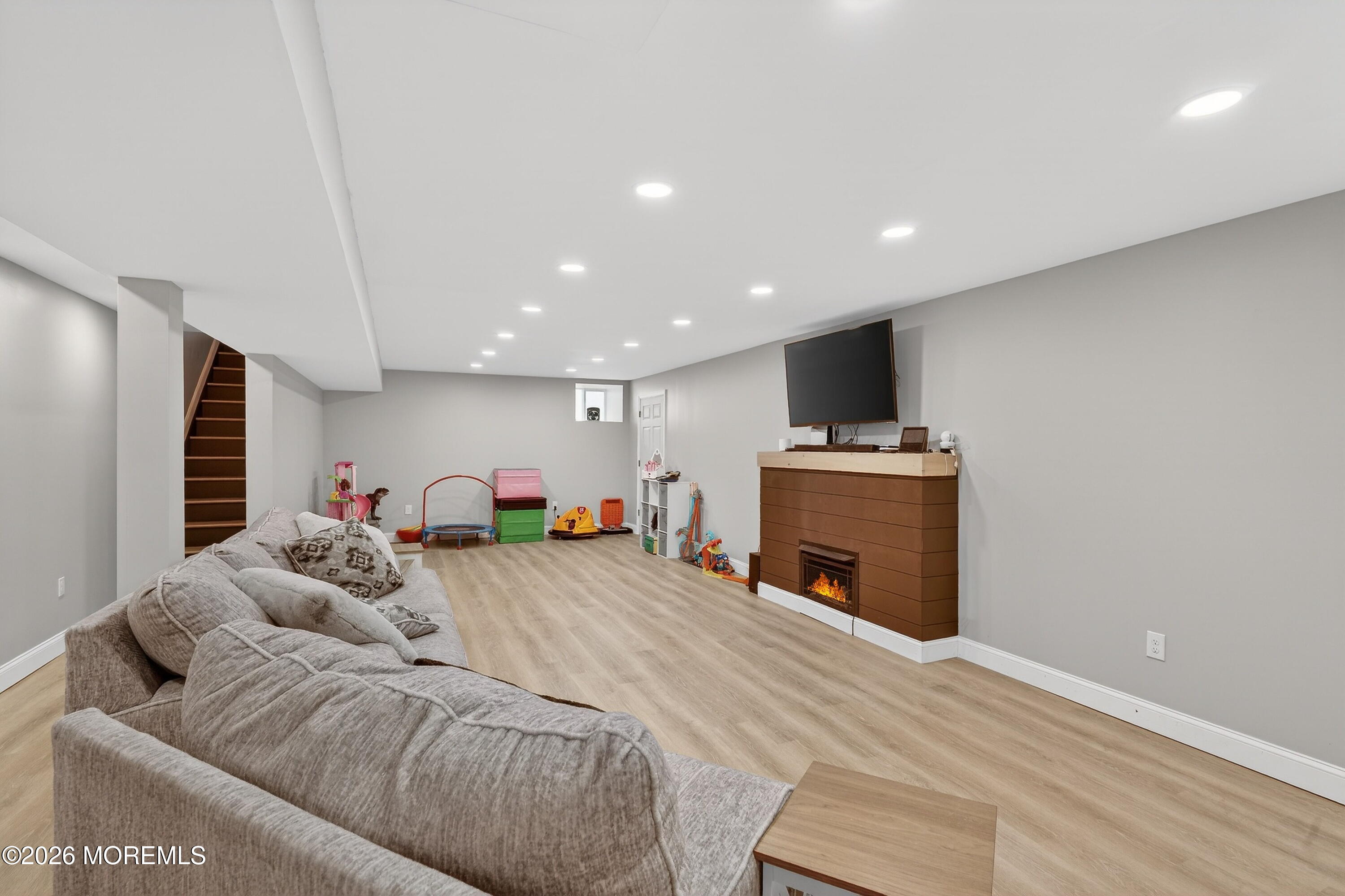 1660 Joffre Road Forked River, NJ 08731 - Photo 26 of 35 a bed room with a bed and a television