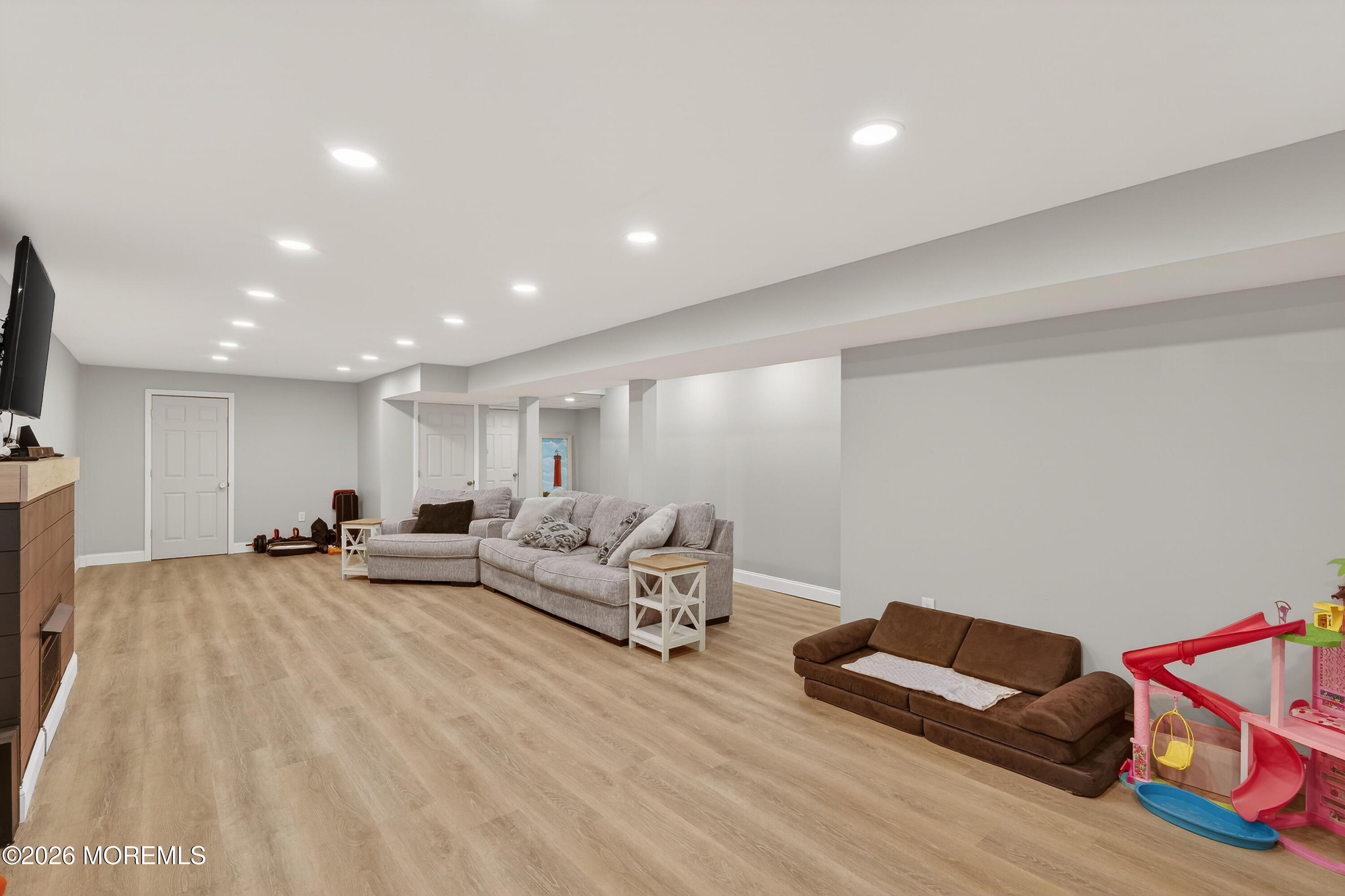 1660 Joffre Road Forked River, NJ 08731 - Photo 28 of 35 a living room with furniture and a flat screen tv