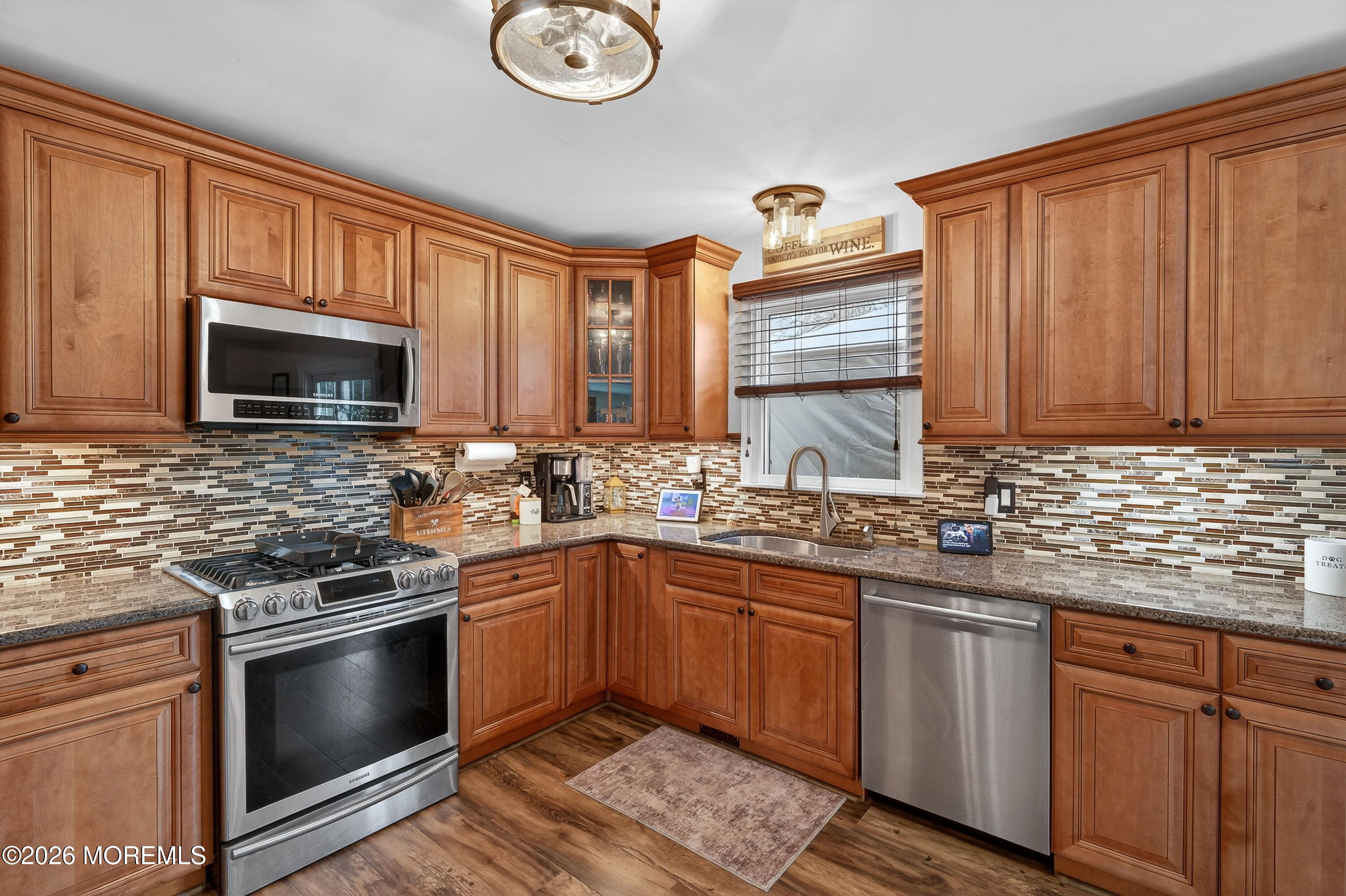 1660 Joffre Road Forked River, NJ 08731 - Photo 4 of 35 a kitchen with stainless steel appliances granite countertop a sink stove microwave and cabinets