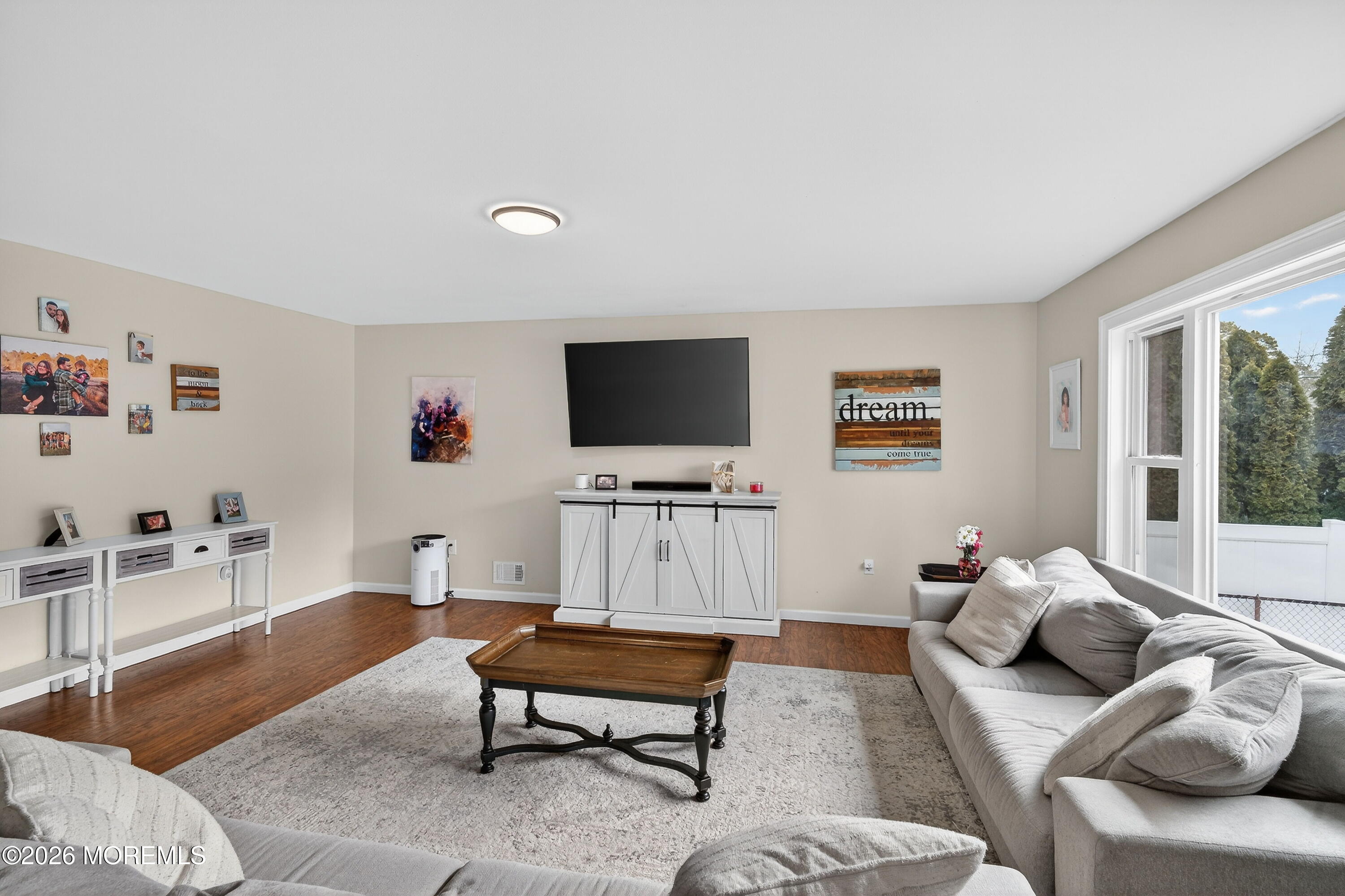 1660 Joffre Road Forked River, NJ 08731 - Photo 4 of 35 a living room with furniture and a flat screen tv