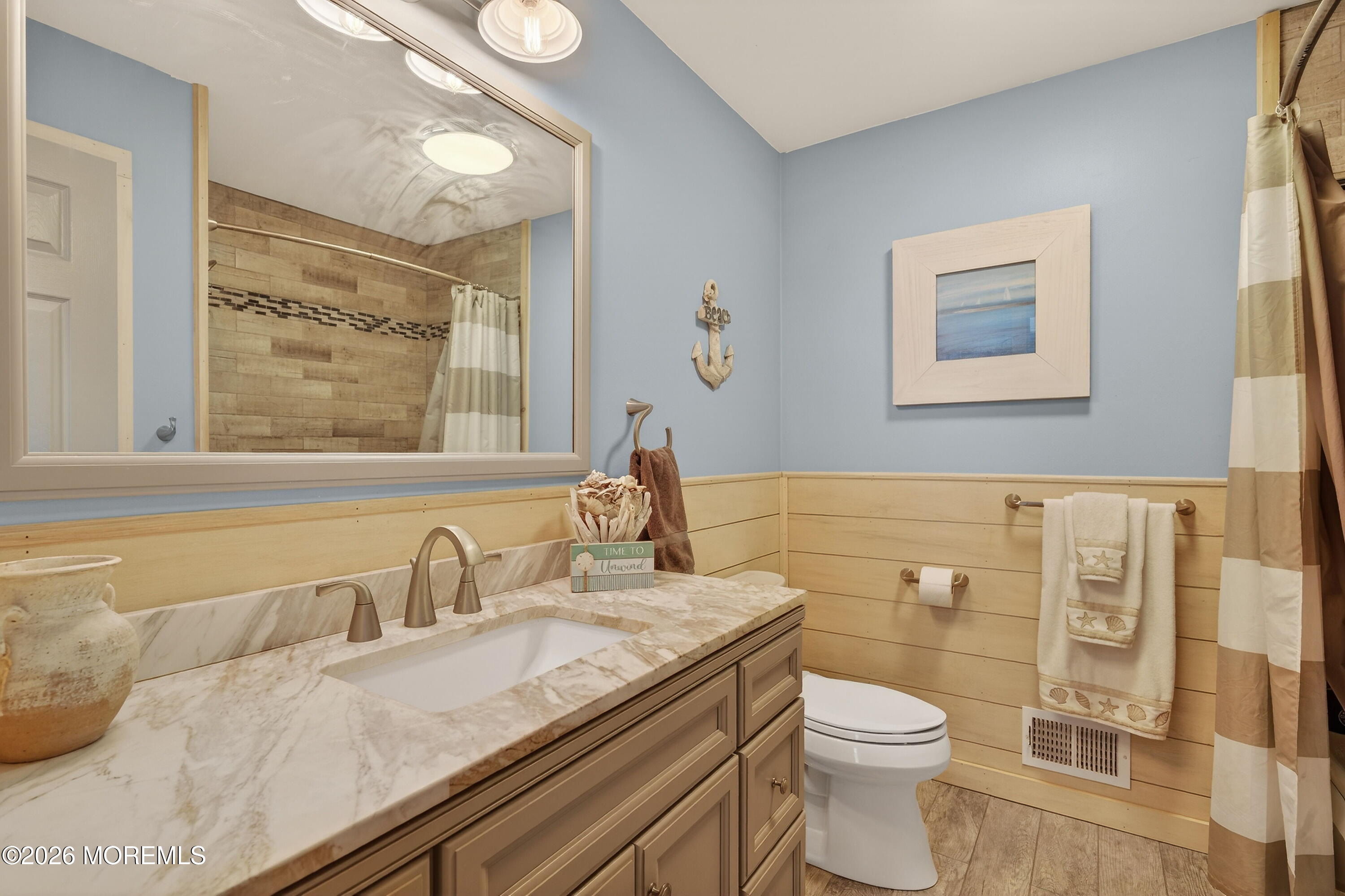 1660 Joffre Road Forked River, NJ 08731 - Photo 8 of 35 a bathroom with a granite countertop sink a toilet and a mirror