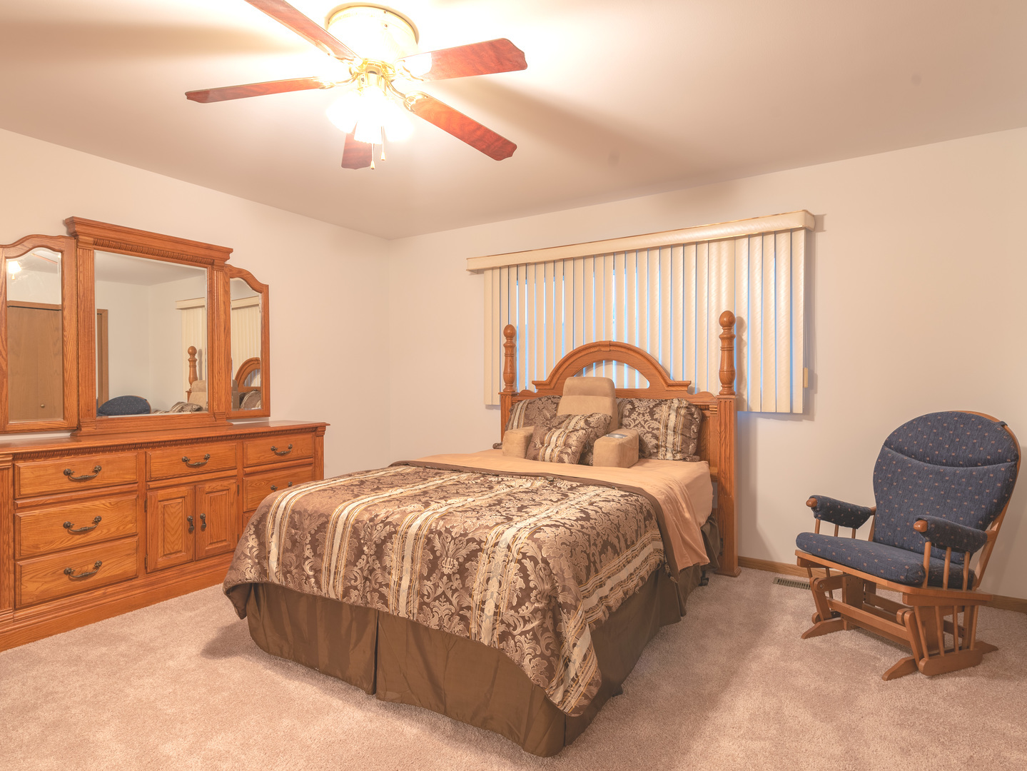 17841 Maine Court Orland Park, IL 60467 - Photo 24 of 29 a bedroom with a bed a chair and a chandelier