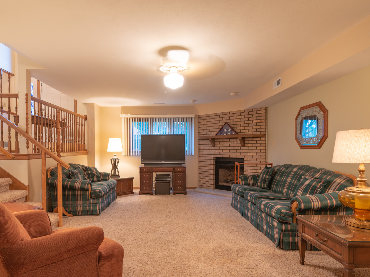 17841 Maine Court Orland Park, IL 60467 - Photo 4 of 29 a living room with furniture a fireplace and a flat screen tv