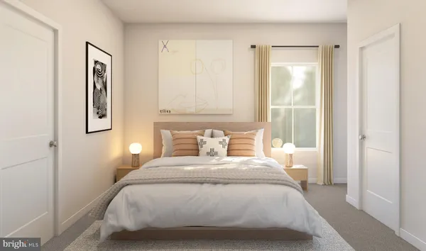 a bedroom with a bed and painting on the wall