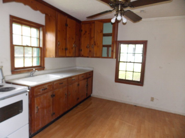 454 Cochran, GA 31014 - Photo 6 of 8 a kitchen with a sink and a window
