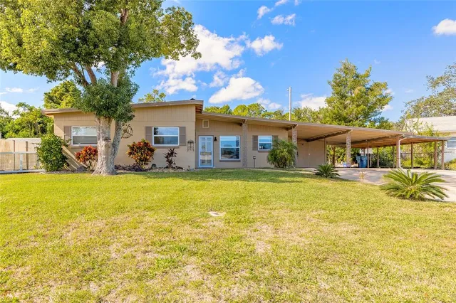 a front view of house with yard and seating area