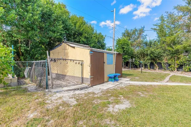 an aerial view of a house with garden space and street view