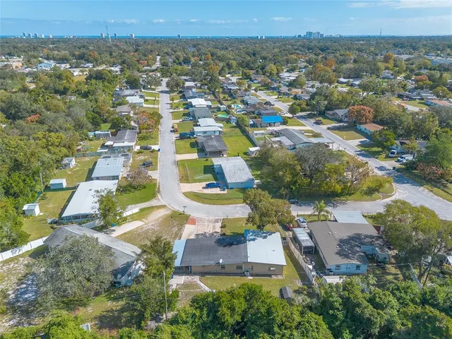 an aerial view of a house with a swimming pool