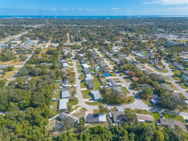 an aerial view of a house with a swimming pool