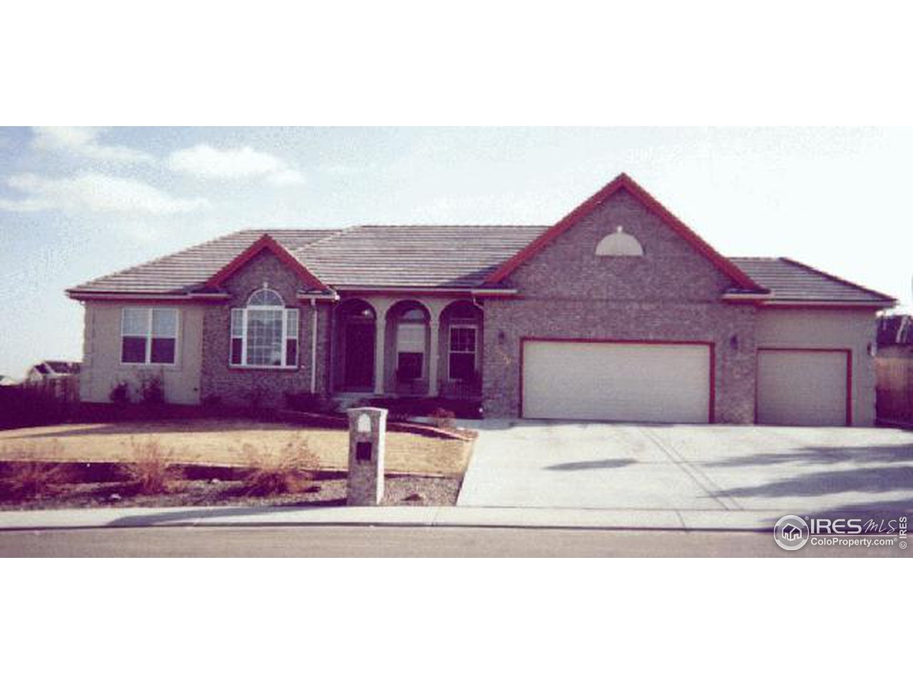 1870 Red Cloud Road Longmont, CO 80504 - Photo 1 of 1 a front view of a house with a yard and garage