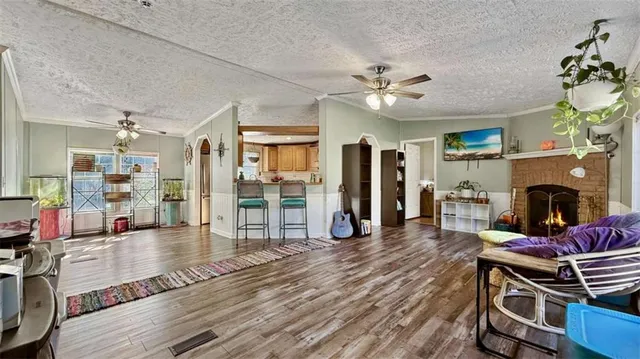 a living room with furniture and a fireplace