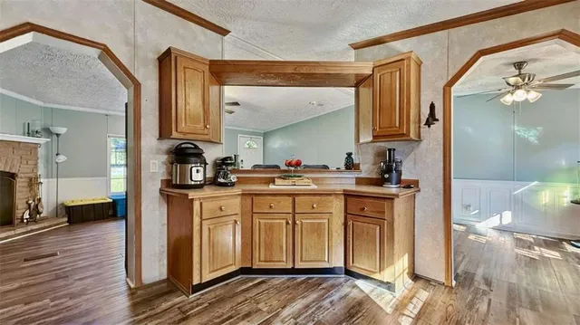 a kitchen with stainless steel appliances granite countertop a stove and a microwave