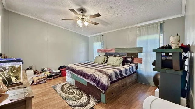 a bedroom with a bed a chandelier and closet
