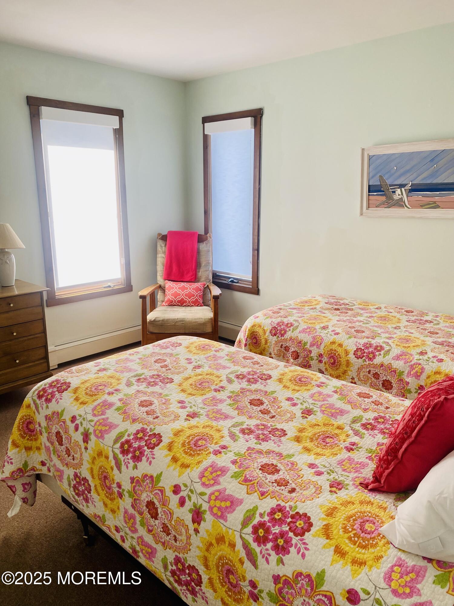 104 5th Avenue, Unit UP Seaside Heights, NJ 08751 - Photo 11 of 17 a bedroom with a bed and a lamp