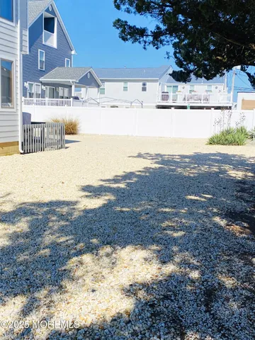 a view of ocean with large trees