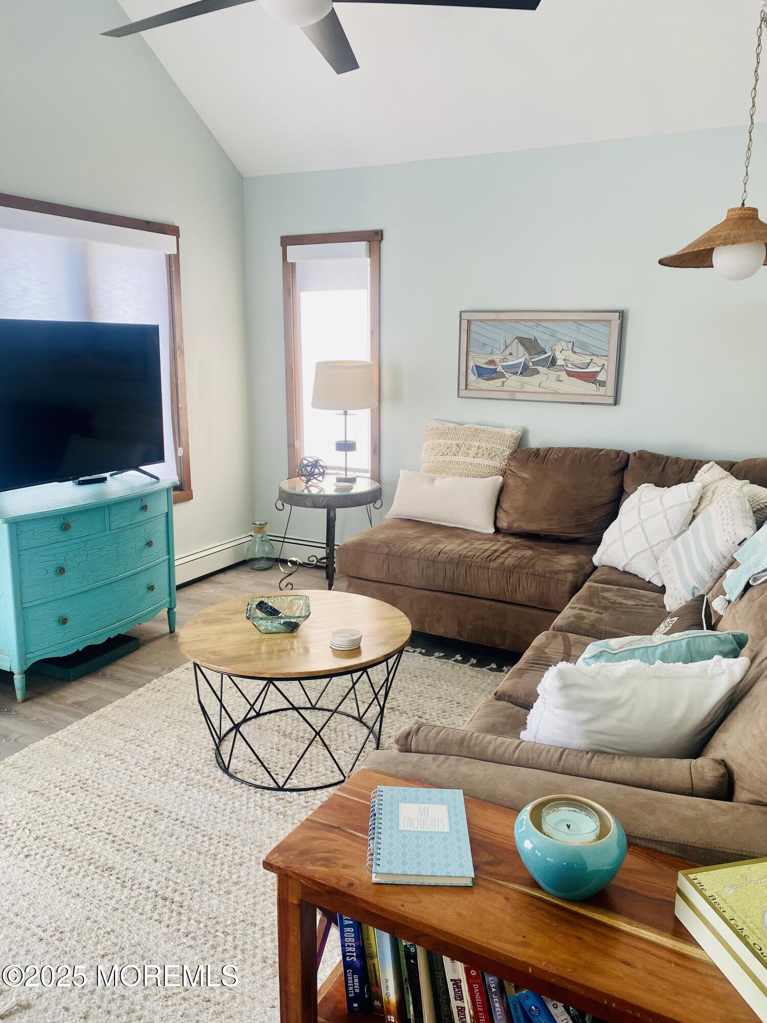 104 5th Avenue, Unit UP Seaside Heights, NJ 08751 - Photo 4 of 17 a living room with furniture and a flat screen tv