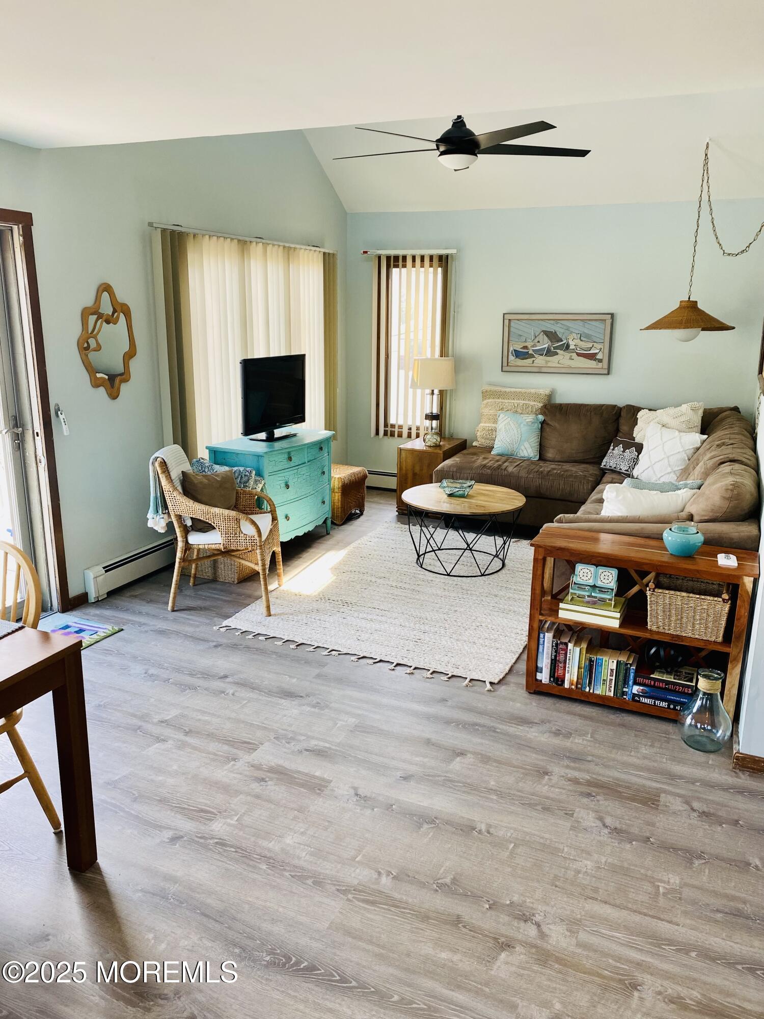 104 5th Avenue, Unit UP Seaside Heights, NJ 08751 - Photo 8 of 17 a living room with furniture and a fireplace