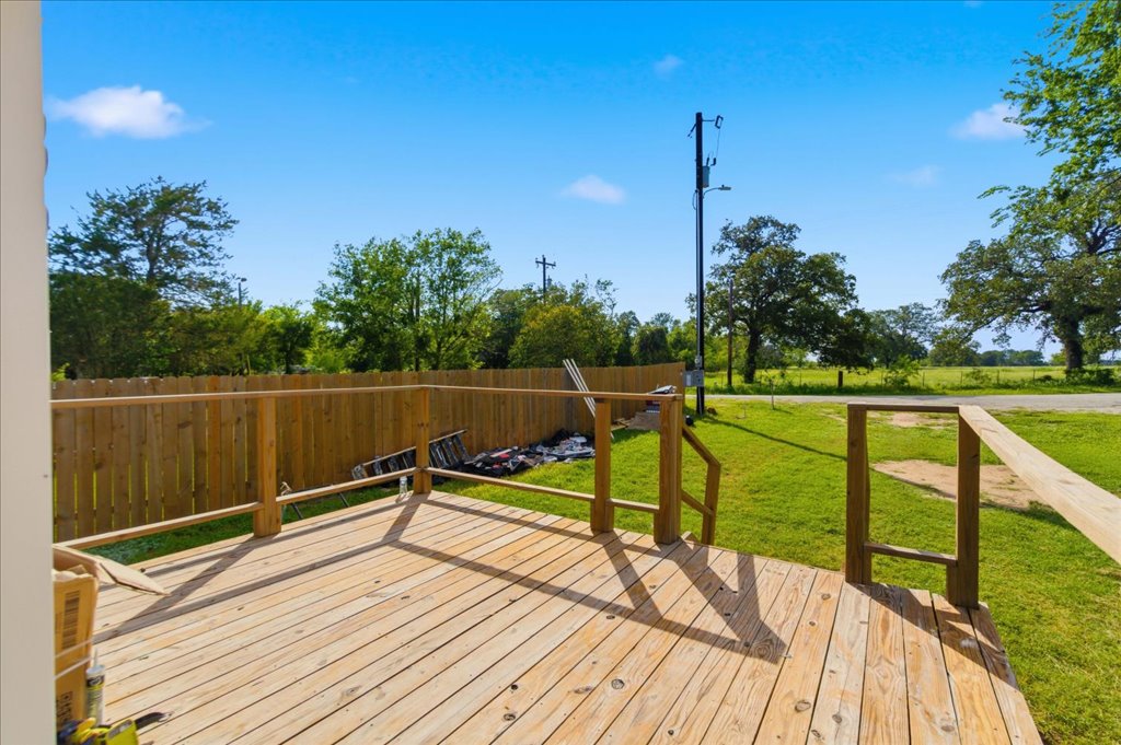 189 Watterson Road Bastrop, TX 78602 - Photo 5 of 22 A spacious wooden deck provides ample outdoor living space. Picture sitting on your deck with your morning coffee.