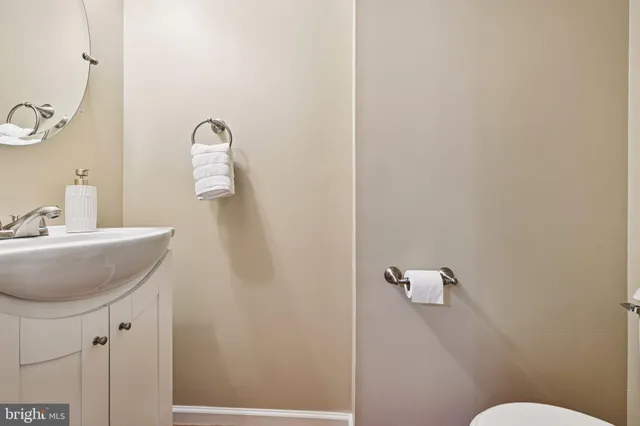a bathroom with a sink and mirror