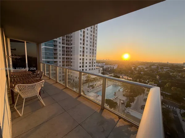 a view of balcony with furniture