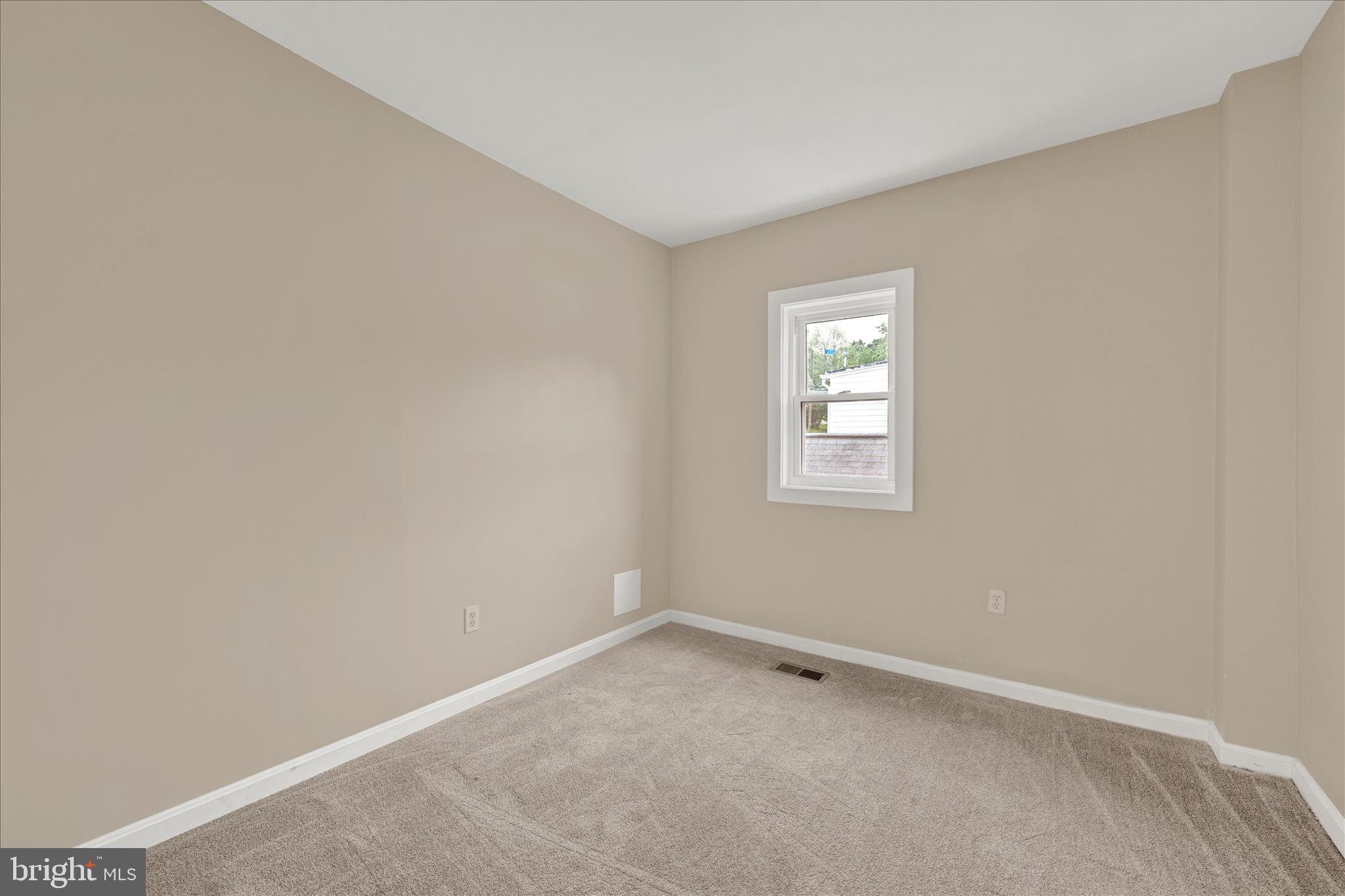 8511 Frederick Road Ellicott City, MD 21043 - Photo 27 of 36 an empty room with a window