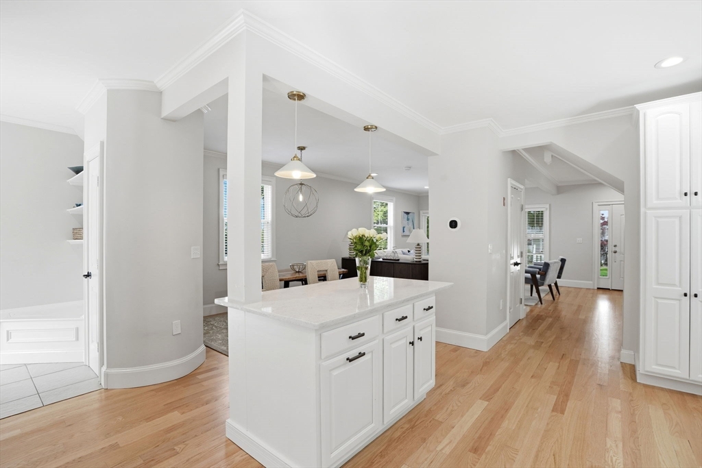 59 Elm Street Hingham, MA 02043 - Photo 10 of 33 a large white kitchen with cabinets