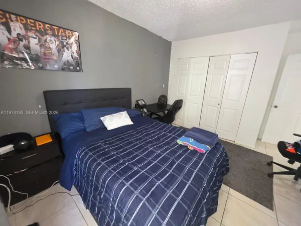 a bedroom with a bed and furniture
