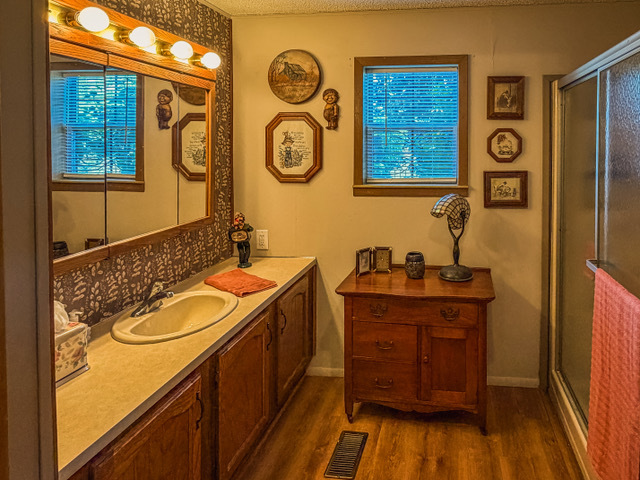 38569 North Sheridan Road, Unit 390 Beach Park, IL 60099 - Photo 10 of 28 a bathroom with a sink and a mirror