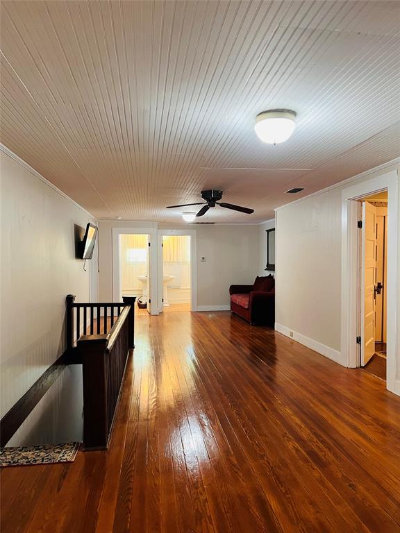 505 North Elm Street Comanche, TX 76442 - Photo 20 of 40 a view of a room with wooden floor and staircase
