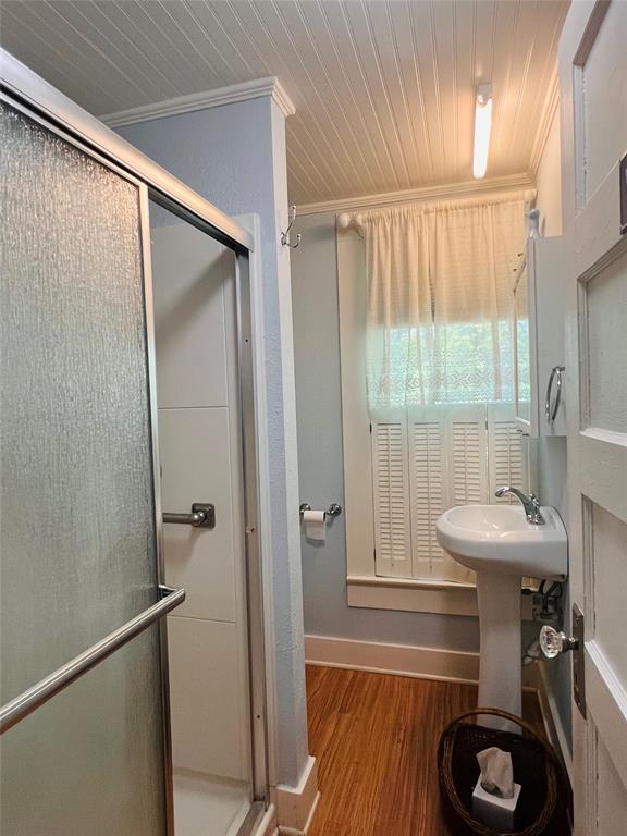 505 North Elm Street Comanche, TX 76442 - Photo 27 of 40 a bathroom with a sink and a mirror