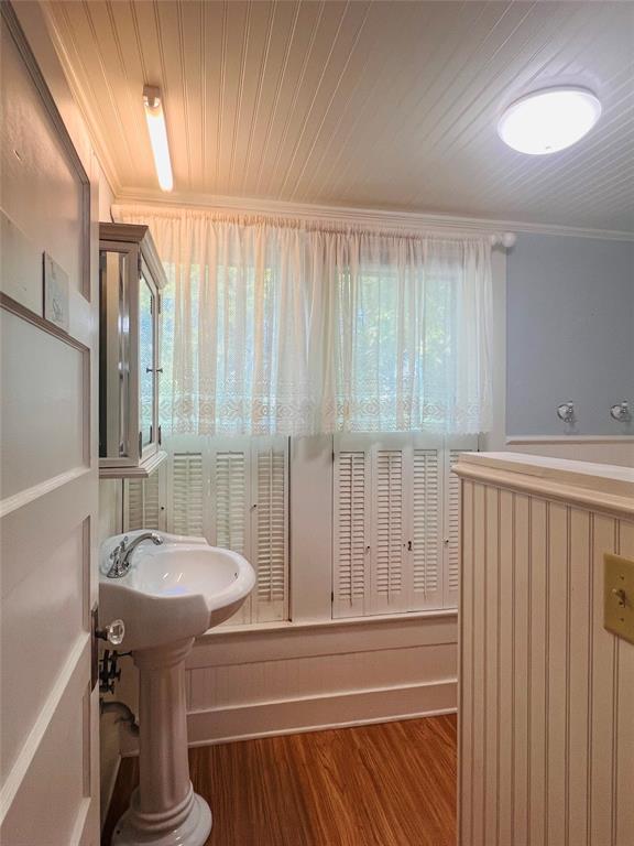 505 North Elm Street Comanche, TX 76442 - Photo 28 of 40 a bathroom with a sink and a mirror