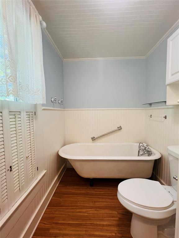 505 North Elm Street Comanche, TX 76442 - Photo 29 of 40 a bathroom with a sink mirror vanity and toilet