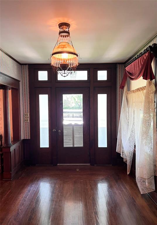505 North Elm Street Comanche, TX 76442 - Photo 30 of 40 a view of empty room with wooden floor and fan