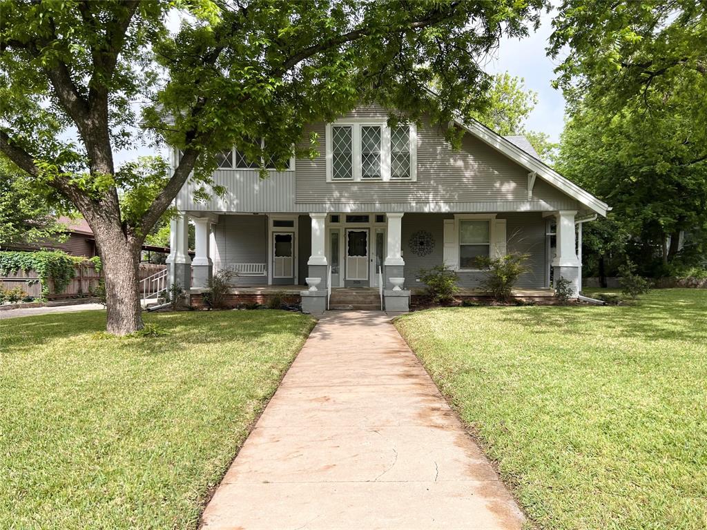 505 North Elm Street Comanche, TX 76442 - Photo 3 of 40 a front view of house with yard