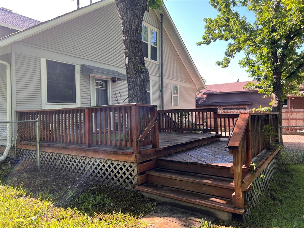 505 North Elm Street Comanche, TX 76442 - Photo 34 of 40 a view of a wooden deck with a bench