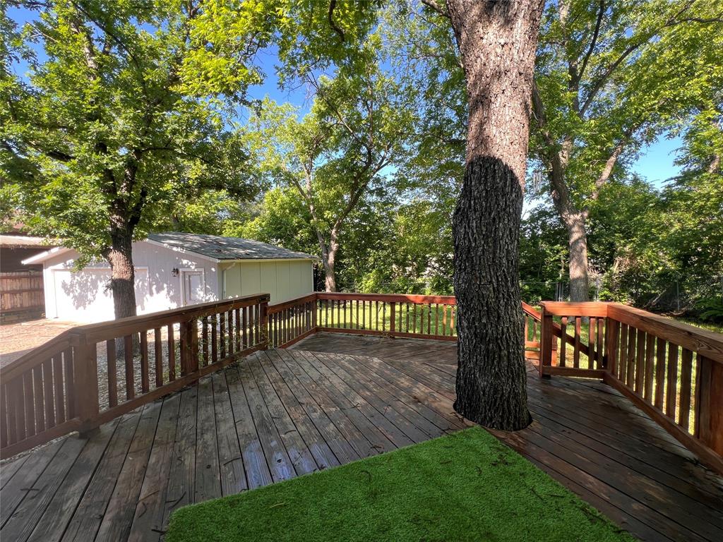 505 North Elm Street Comanche, TX 76442 - Photo 36 of 40 a view of a deck with a yard