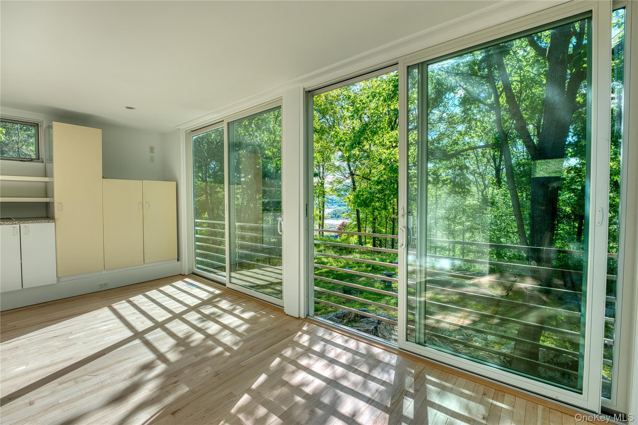 61 Indian Brook Road Garrison, NY 10524 - Photo 13 of 23 a view of a room with large windows