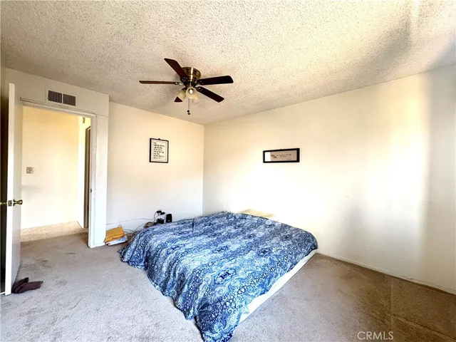 a bed in a room next to a window