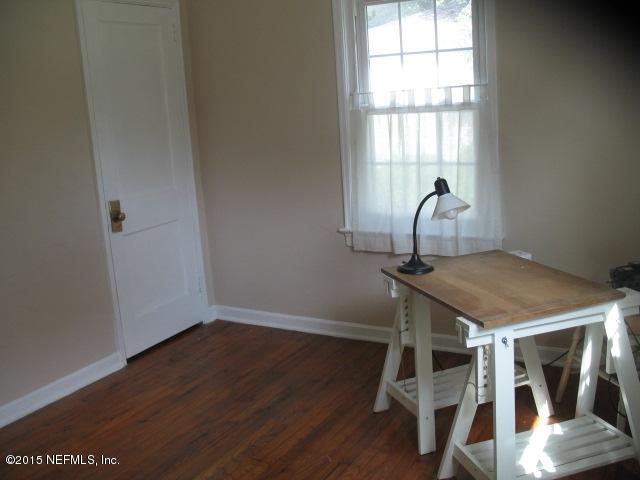 4834 Dundee Road Jacksonville, FL 32210 - Photo 14 of 28 a bathroom with a sink and a window