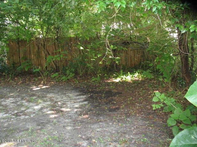 4834 Dundee Road Jacksonville, FL 32210 - Photo 24 of 28 a view of a yard with plants and large trees