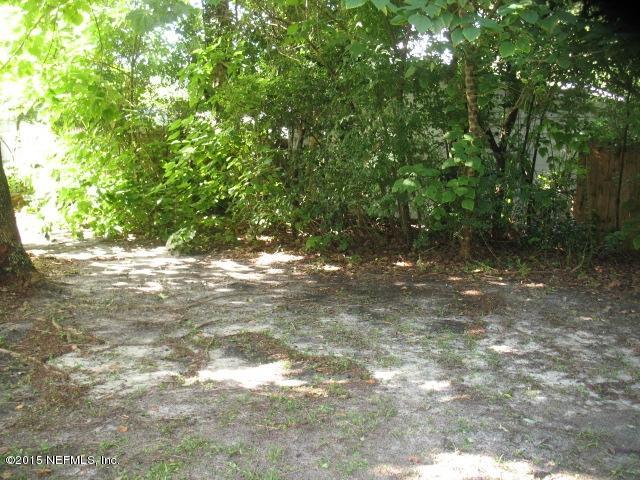 4834 Dundee Road Jacksonville, FL 32210 - Photo 26 of 28 a view of a yard with plants and large trees